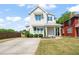 Charming two-story home with a well-manicured lawn, concrete driveway, and delightful curb appeal at 512 Montague Ln, Raleigh, NC 27601
