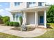 Inviting front entrance featuring a blue door, decorative wreath, and manicured landscaping at 512 Montague Ln, Raleigh, NC 27601