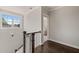 Bright hallway features hardwood floors, a window and leads to the bedrooms at 512 Montague Ln, Raleigh, NC 27601