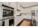 Modern kitchen showcasing stainless steel oven and cooktop against white subway tile at 512 Montague Ln, Raleigh, NC 27601