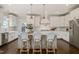 Modern kitchen island with seating, stylish pendants, and stainless steel appliances at 512 Montague Ln, Raleigh, NC 27601