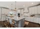 Bright kitchen features a large island, stainless steel appliances, and white cabinetry at 512 Montague Ln, Raleigh, NC 27601