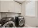 Convenient laundry room with modern washer and dryer units, and bright natural light at 512 Montague Ln, Raleigh, NC 27601