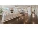 Expansive living room showcasing kitchen, hardwood floors, fireplace, and natural light at 512 Montague Ln, Raleigh, NC 27601