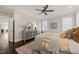 Comfortable main bedroom featuring a ceiling fan, sitting area, and a stylish dresser at 512 Montague Ln, Raleigh, NC 27601