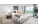 Inviting bedroom with patterned wallpaper, a large window, and stylish furniture at 517 Fife Ct, Gibsonville, NC 27249