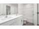 Modern bathroom with double vanity, white cabinetry, and shower-tub combination at 525 Lochalsh Dr, Gibsonville, NC 27249