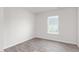 Cozy bedroom featuring wood-look floors and a bright window offering natural light at 525 Lochalsh Dr, Gibsonville, NC 27249