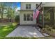 This backyard has an outdoor patio, nice landscaping, and a screened porch at 5600 Bennettwood Ct, Raleigh, NC 27612