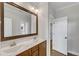 Bathroom vanity with a double sink, an ornate mirror, and ample storage at 5600 Bennettwood Ct, Raleigh, NC 27612
