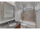 Bathroom featuring granite counters, a classic tile surround, and ample lighting at 5600 Bennettwood Ct, Raleigh, NC 27612