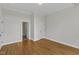 Bright room with multiple entryways and hardwood flooring at 5600 Bennettwood Ct, Raleigh, NC 27612