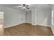 This bedroom features hardwood floors, a closet, and neutral paint at 5600 Bennettwood Ct, Raleigh, NC 27612