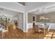 Open-concept dining room with hardwood floors and detailed trim work at 5600 Bennettwood Ct, Raleigh, NC 27612