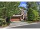 Charming two-story brick home with a manicured lawn and a two-car garage and stone accents at 5600 Bennettwood Ct, Raleigh, NC 27612