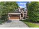 Charming two-story brick home with a well-manicured lawn and a two-car garage at 5600 Bennettwood Ct, Raleigh, NC 27612