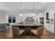 Well-appointed kitchen features a large central island with seating and stainless steel appliances at 5600 Bennettwood Ct, Raleigh, NC 27612