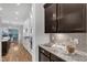 Open-concept kitchen boasts stainless steel appliances and granite countertops at 5600 Bennettwood Ct, Raleigh, NC 27612