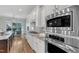 Bright kitchen features stainless steel appliances, white cabinetry, granite countertops, and a breakfast nook at 5600 Bennettwood Ct, Raleigh, NC 27612