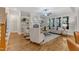Bright living room with a fireplace, built-in bookshelves, and large windows at 5600 Bennettwood Ct, Raleigh, NC 27612