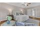 Comfortable main bedroom featuring a ceiling fan, white bed linens, and a decorative rug at 5600 Bennettwood Ct, Raleigh, NC 27612