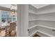 Walk-in pantry features custom shelving and ample storage space for kitchen essentials at 5600 Bennettwood Ct, Raleigh, NC 27612