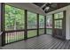 This screened porch features a ceiling fan and a view of the backyard at 5600 Bennettwood Ct, Raleigh, NC 27612