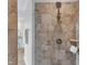 Modern shower with patterned tile, glass surround, and wall-mounted shower head at 5600 Bennettwood Ct, Raleigh, NC 27612
