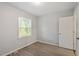 Bedroom offers vinyl flooring, a window bringing natural light to the space at 5613 Deerborn Dr, Apex, NC 27539