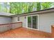 A spacious deck with wood railings and sliding glass door to the house at 5613 Deerborn Dr, Apex, NC 27539