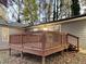 A wooden deck that steps down into the yard, great for outdoor relaxation and entertaining at 5613 Deerborn Dr, Apex, NC 27539