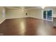 Bright living room with hardwood floors and sliding glass doors to the outdoor deck at 5613 Deerborn Dr, Apex, NC 27539