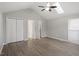 Bedroom with vaulted ceiling, skylight, ceiling fan, closet, and doorway to bathroom at 5613 Deerborn Dr, Apex, NC 27539