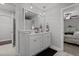Bright bathroom featuring a double vanity, stylish mirror, and modern fixtures at 60 Northdale Ct, Louisburg, NC 27549