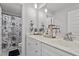 Bright bathroom featuring a double vanity, stylish mirror, and modern fixtures at 60 Northdale Ct, Louisburg, NC 27549