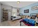 Shared bedroom featuring two twin beds, playful decor and ample storage at 60 Northdale Ct, Louisburg, NC 27549