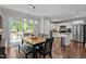 Inviting dining area features seamless flow into the kitchen and an adjacent outdoor patio at 60 Northdale Ct, Louisburg, NC 27549