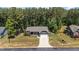 This lovely home boasts a charming front porch, a well-manicured lawn, and an attached two car garage at 60 Northdale Ct, Louisburg, NC 27549