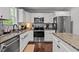 Bright kitchen featuring modern appliances, granite countertops, and ample cabinet space at 60 Northdale Ct, Louisburg, NC 27549
