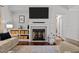Stylish living room showcases a fireplace, wooden floors, and a seamless blend of comfort at 60 Northdale Ct, Louisburg, NC 27549