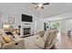 Bright living room features a fireplace, vaulted ceiling, and seamless flow to the dining area at 60 Northdale Ct, Louisburg, NC 27549