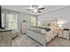 Cozy main bedroom with carpeted floors, natural lighting, and comfortable furnishings at 60 Northdale Ct, Louisburg, NC 27549