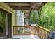 An outdoor balcony with wooden railings offers views of trees and other building balconies at 629 Pine Ridge Pl, Raleigh, NC 27609