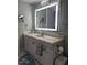 Bathroom featuring a modern vanity with a large illuminated mirror at 629 Pine Ridge Pl, Raleigh, NC 27609
