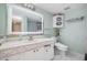Well-lit bathroom featuring a vanity with marble countertop and modern fixtures at 629 Pine Ridge Pl, Raleigh, NC 27609