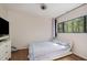 Bedroom featuring a comfortable bed, dresser, and window with natural light at 629 Pine Ridge Pl, Raleigh, NC 27609