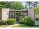 Exterior of a two-story condo unit with wood siding, screened porches, and landscaped walkway and lawn at 629 Pine Ridge Pl, Raleigh, NC 27609