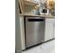 Close-up shot of the stainless steel dishwasher in the kitchen with white cabinets at 629 Pine Ridge Pl, Raleigh, NC 27609