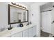 Bathroom featuring a double vanity, large mirrors, and neutral countertops at 7116 Incline Dr, Wake Forest, NC 27587