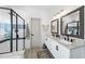 Bright bathroom featuring a double vanity, shower, and tub with modern finishes and fixtures at 7116 Incline Dr, Wake Forest, NC 27587